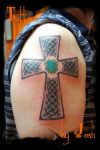 celtic cross tattoo on right arm